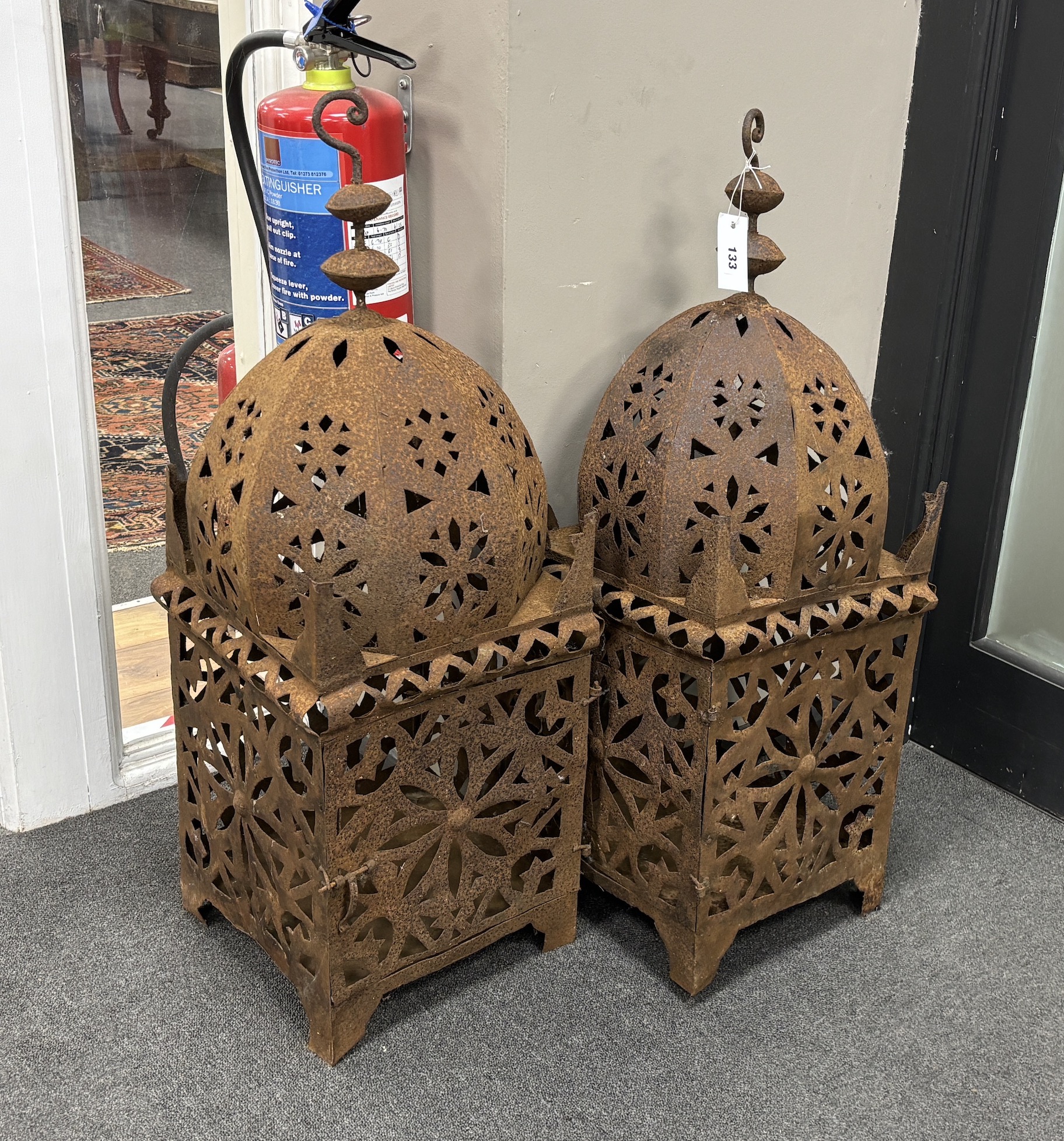 A pair of Moroccan Hispano Moresque pierced iron hanging lamps, height 86cm.